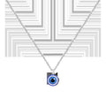 Collar de acero inoxidable plateado con colgante circular de ojo turco azul y cerco de cristales blancos brillantes.