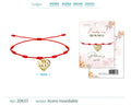 Pulsera roja de 7 nudos con colgante de corazón calado y ojo turco en acero inoxidable dorado.