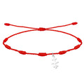 Pulsera de hilo rojo entrelazado con nudos y colgante de Cruz de las Catacumbas en acabado plateado.