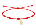 Pulsera de hilo rojo 7 nudos con charm minimalista de la Virgen de la Victoria en acero dorado